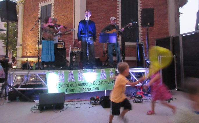 Charmas Trio performing family-friendly live music at Abbott Square in Santa Cruz, California.